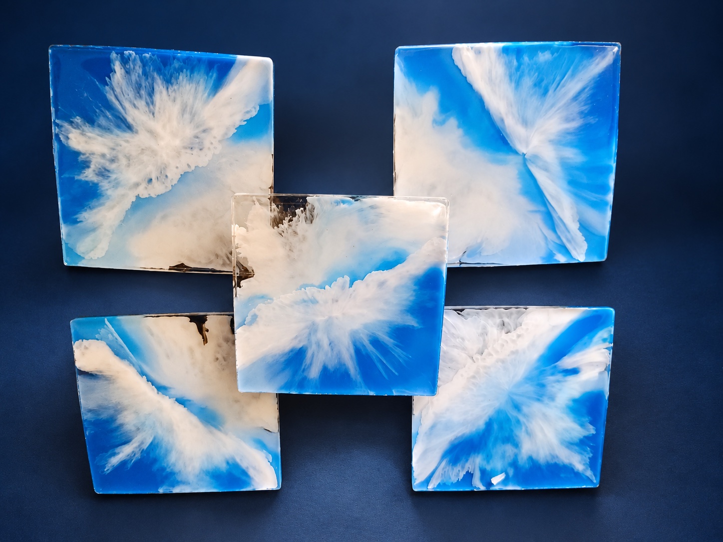Five square blue and white resin wave coasters